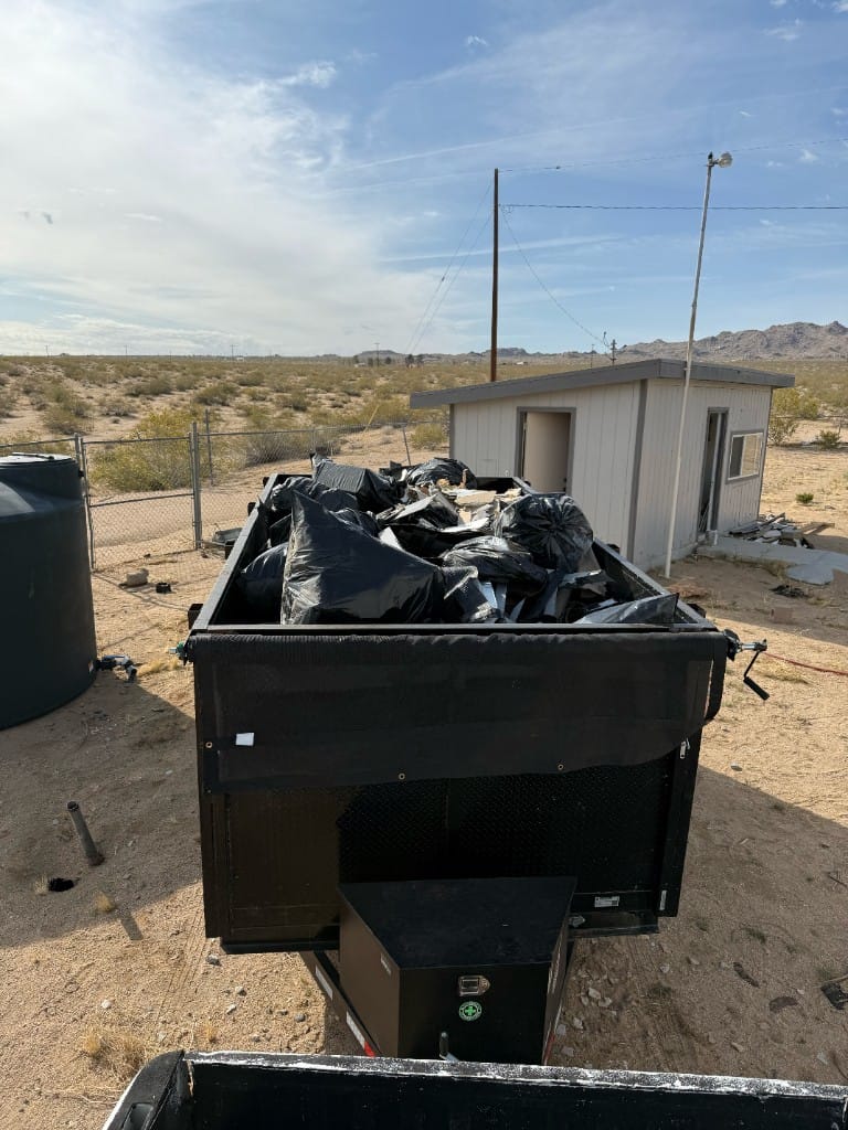 Fully loaded dump trailer after a large junk removal and hauling job