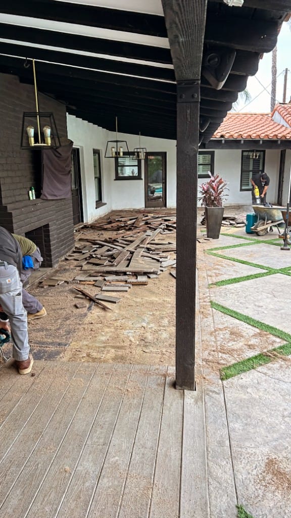 Construction and roofing debris staged for removal at a residential job site