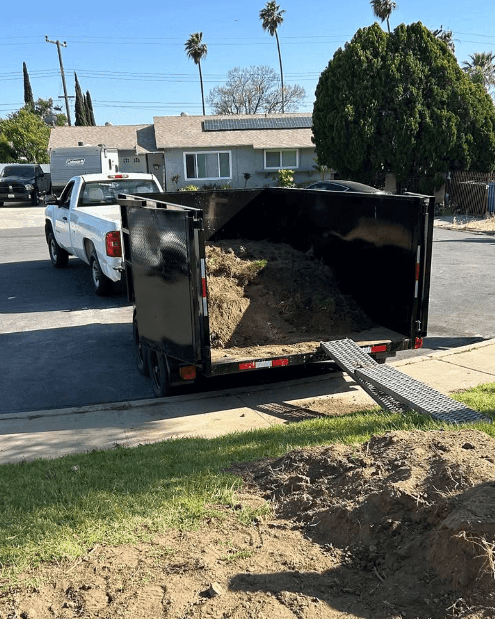 Residential deck demolition and debris removal in progress